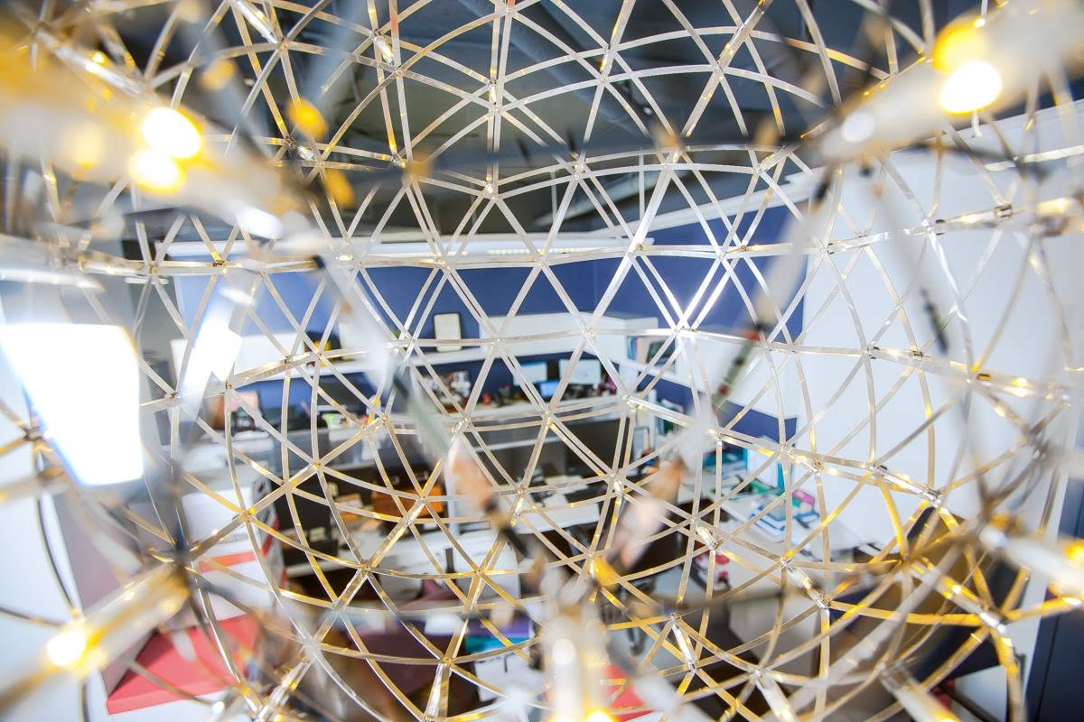 Detail of a sculptural geodesic pendant light installation